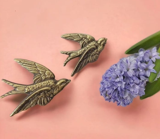 Pair of vintage brass flying swallows