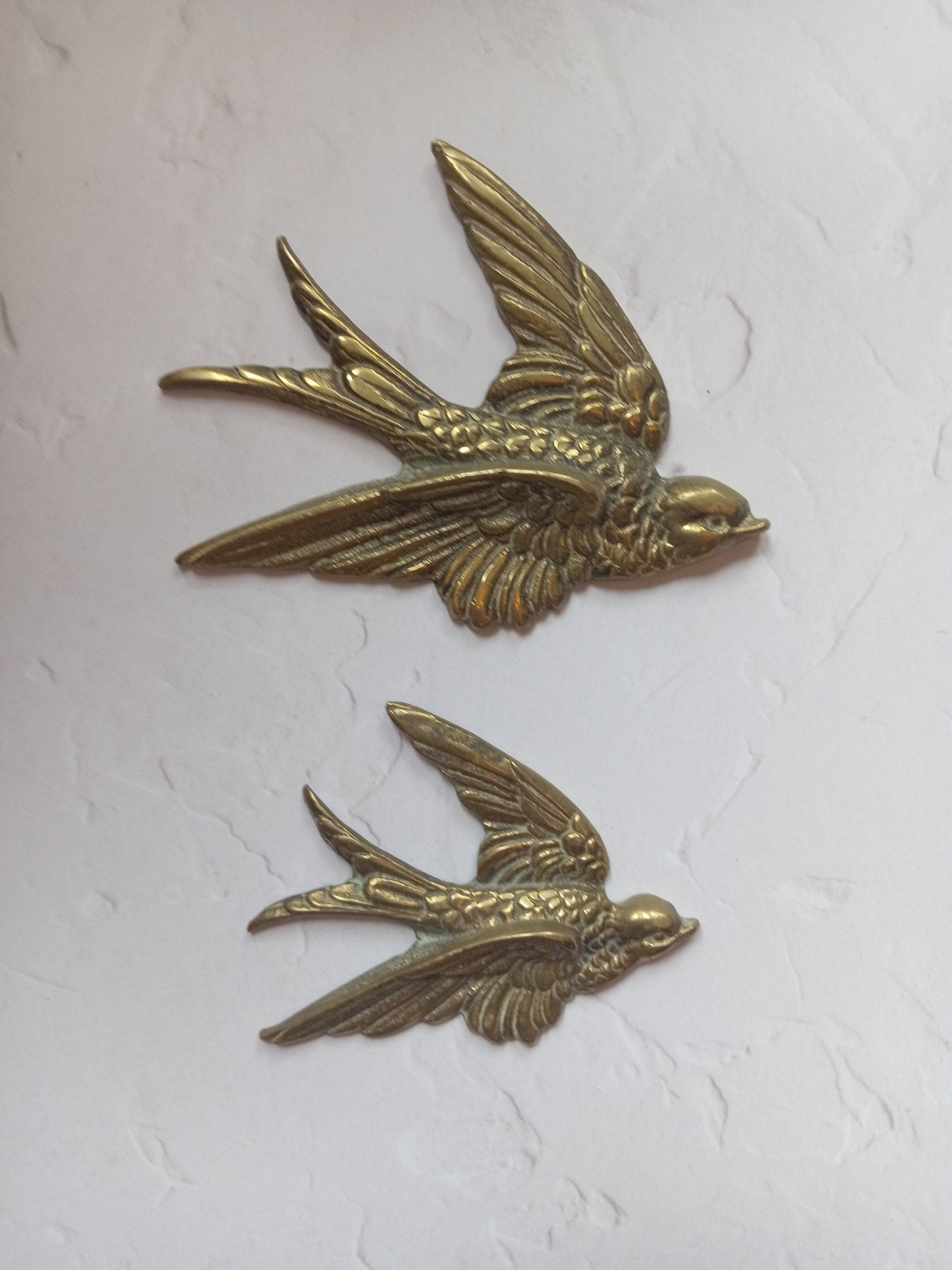 Pair of vintage brass flying swallows