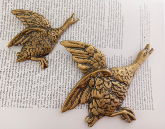 Pair of brass flying ducks