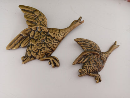 Pair of brass flying ducks