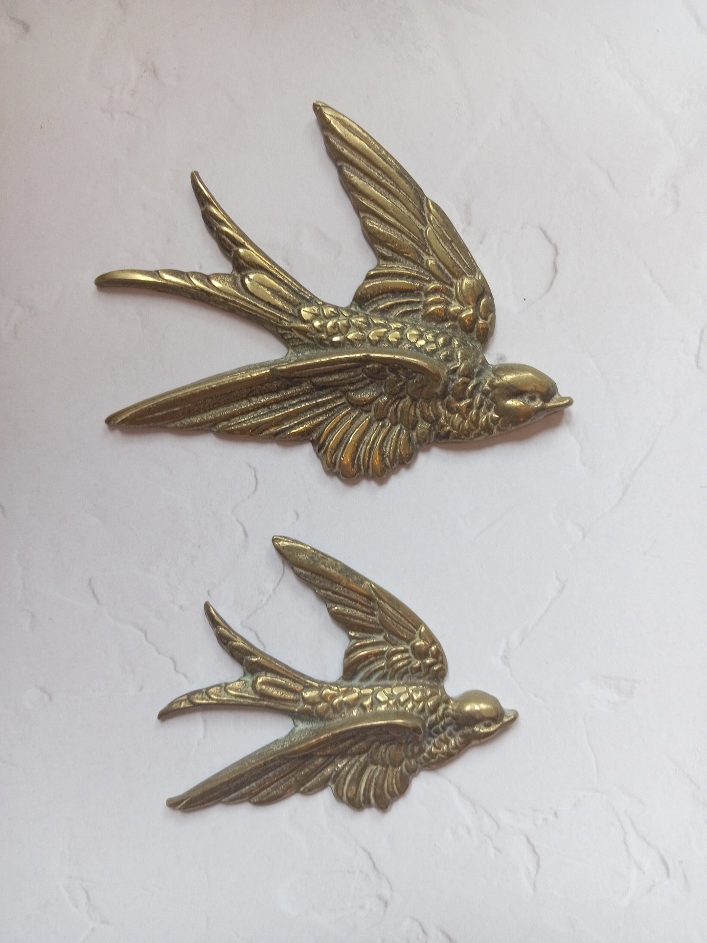 Pair of vintage brass flying swallows